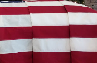 american flag drapped on casket