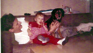 dad, tammy sue age one and dog schotzie on couch